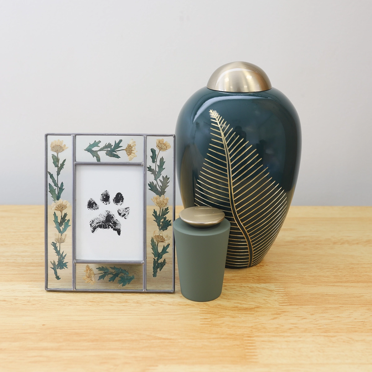 photo fo pawprint and pet urn on table