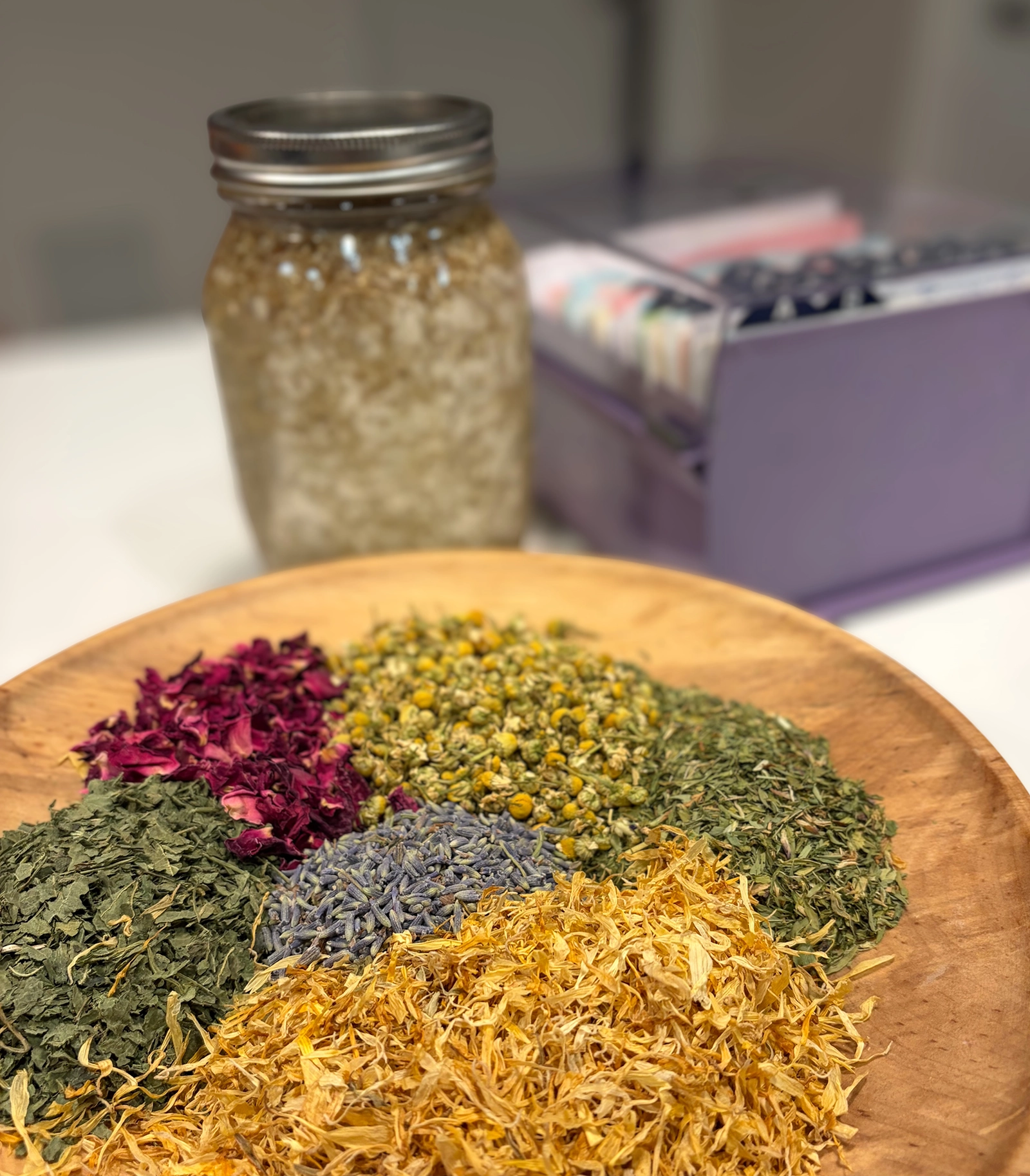 bowl of herbal medicine with a jar and rolodex in background
